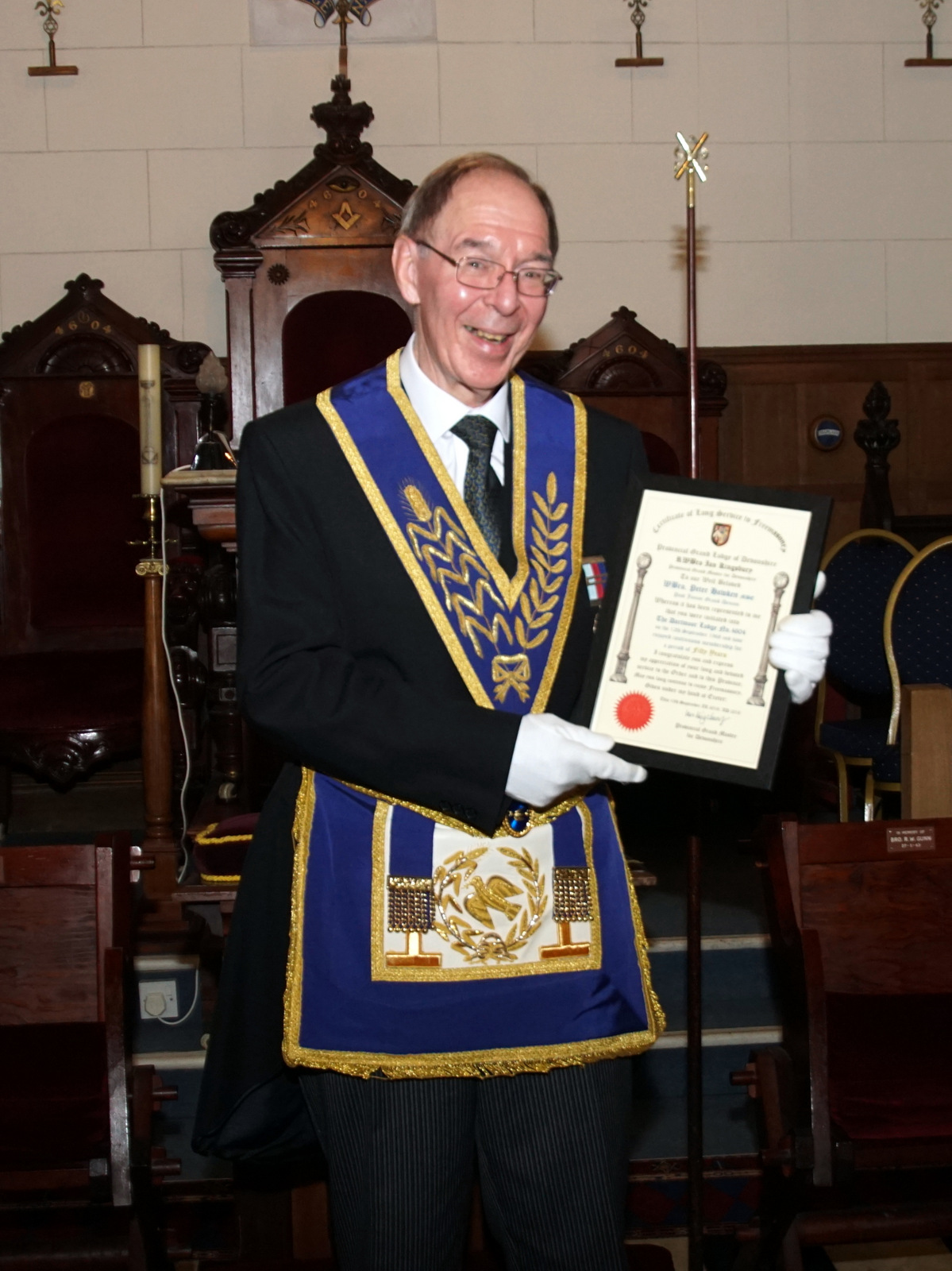 Peter Hawken displaying certificate